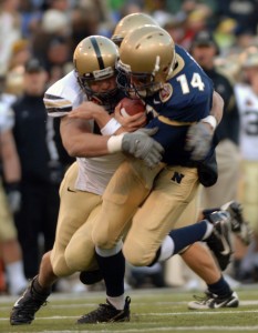 {071201-N-6463B-543} -- Baltimore, MD. (Dec. 1, 2007) -- CAPTION Navy Quarter Back Troy Gross gets sacked by a blitzing Army defender at the 108th annual Army vs. Navy football game at M&T Bank Stadium in Baltimore, MD. The Navy defeated the Black Knights of Army with a score of 38-3. The Navy Midshipmen have now won the past six Army Navy battles. The 8-4 Midshipmen have accepted an invitation to play in the Poinsettia Bowl in San Diego, Ca on Dec. 20th. SLUG LINE U.S. Navy Photo by Mass Communication Specialist 2nd Class (SW/AW) Herbert D. Banks Jr. (RELEASED)